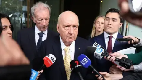 Sex Abuse Allegations Involving Top Australian Media Personality Reduced